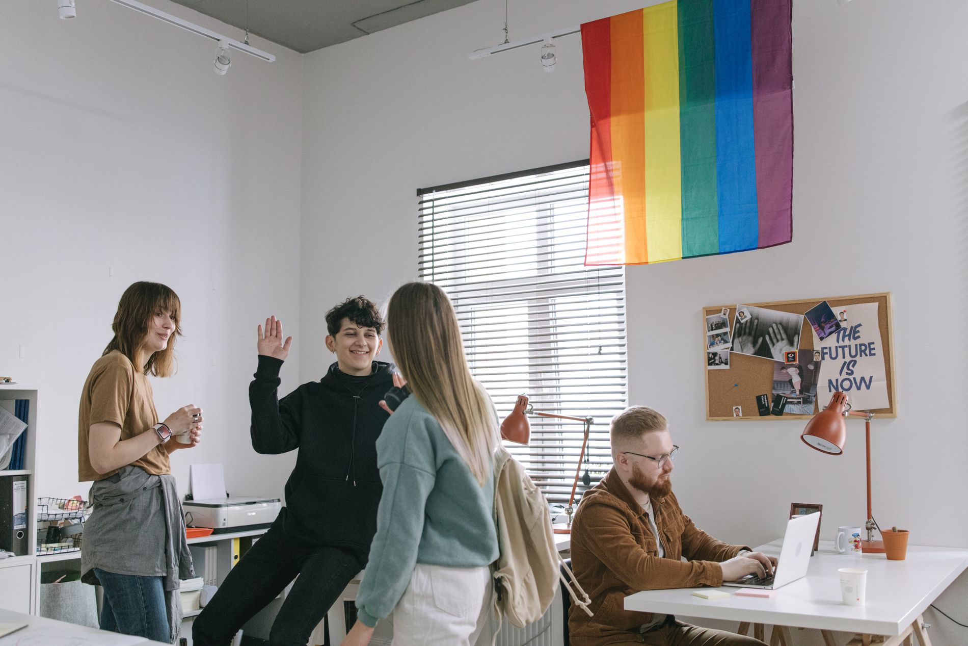 A diverse team celebrating in their workplace